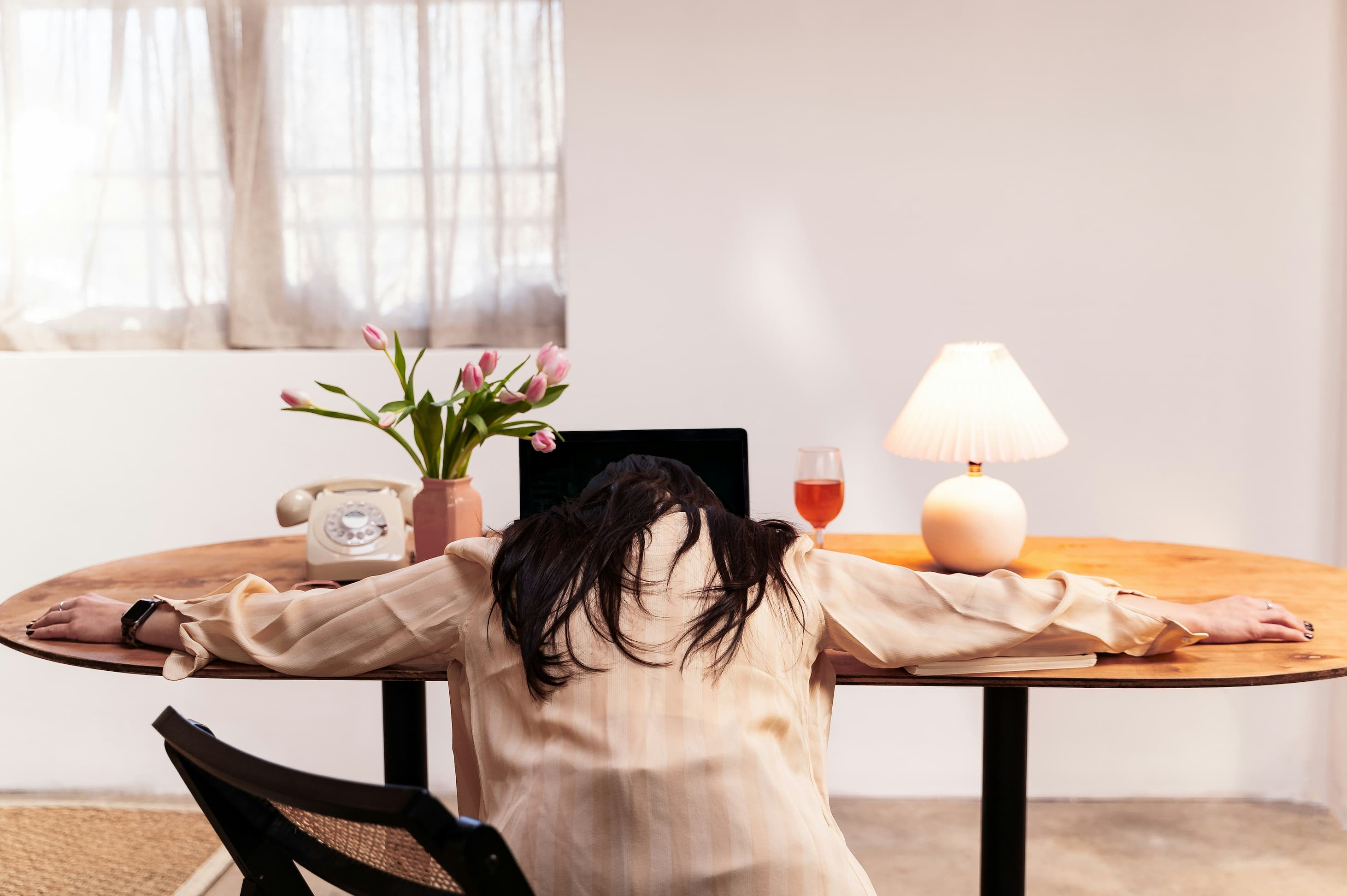 a marketer slumped in front of their laptop in frustration